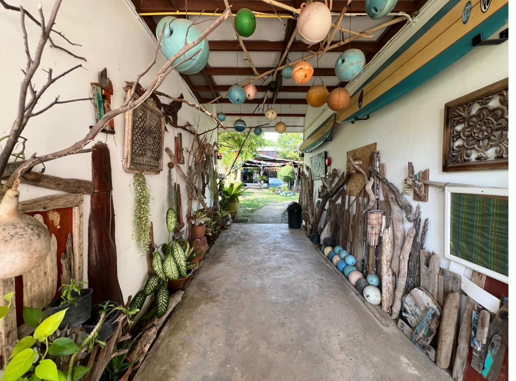 Garden walkway between rooms at Tree Roots Retreat, Rayong