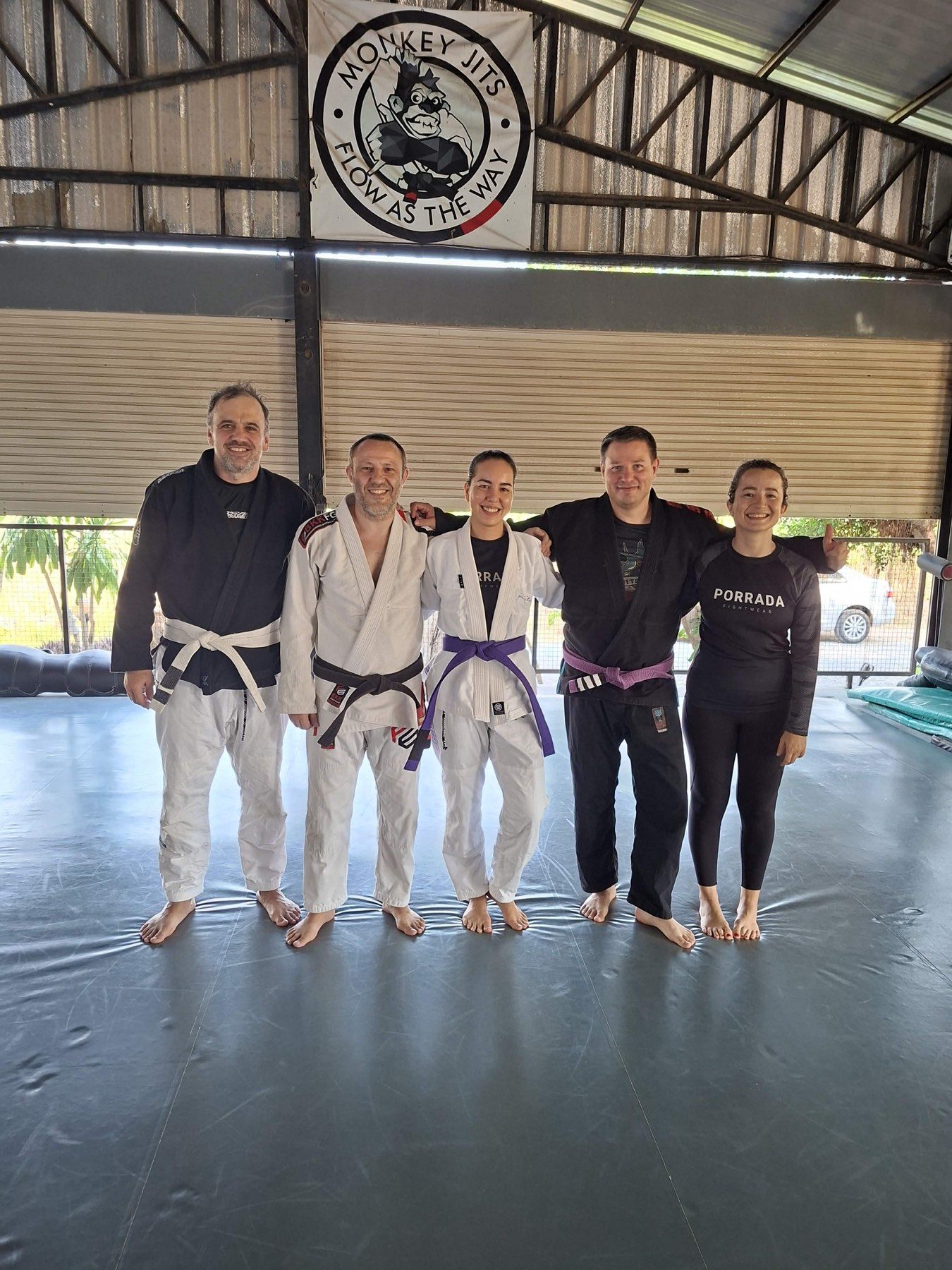 Claire in her purple belt gi with the Tree Roots Retreat jiu-jitsu team in Rayong.